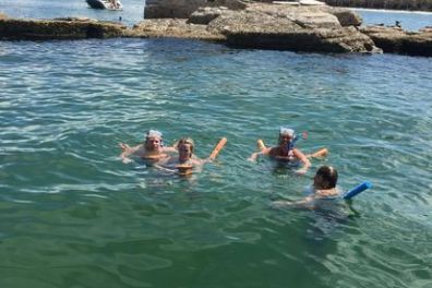 a group of people swimming in the water