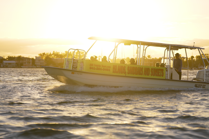 a boat on water at sunset