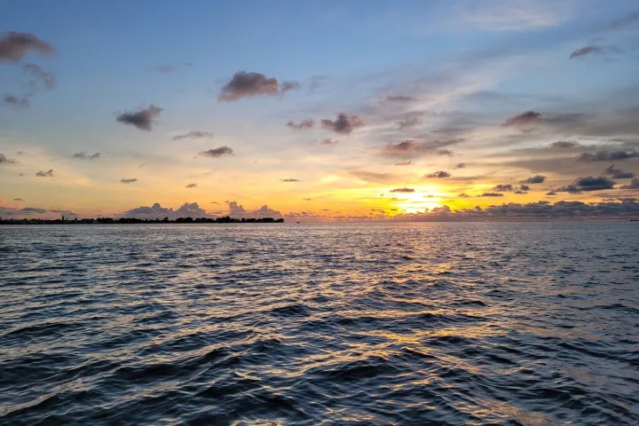 a sunset over a body of water