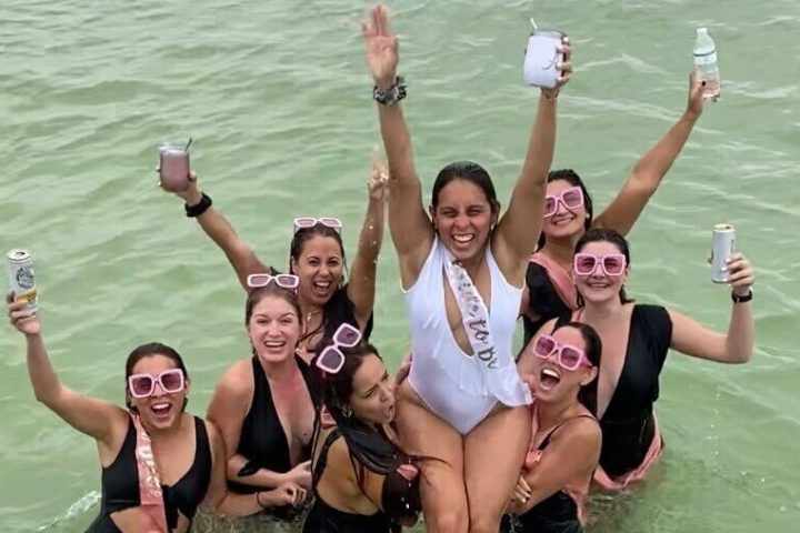 a group of people swimming in a body of water