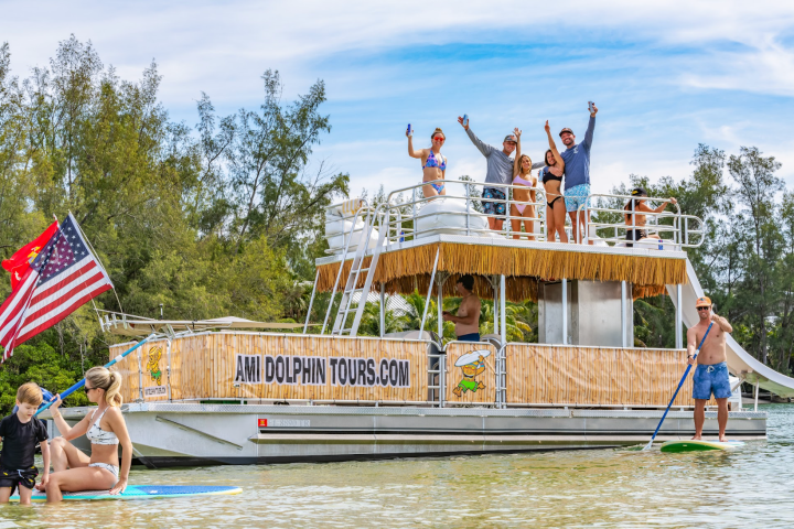 a group of people riding on the back of a boat