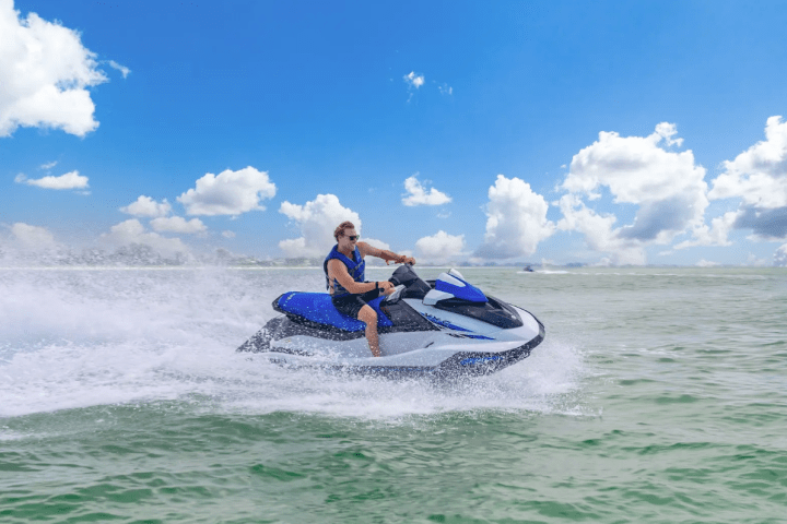 a man riding a wave on top of a body of water